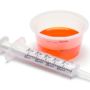 Liquid Medicine in Cup with Oral Syringe.