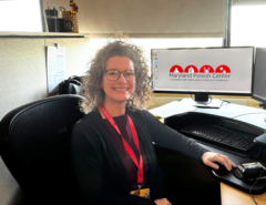 A Maryland Poison Center poison specialist sitting at her desk.